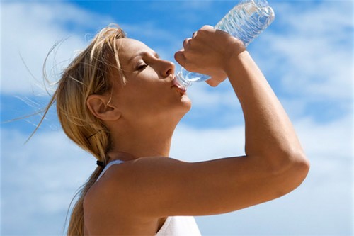 Girl Drinking Water in the Summer